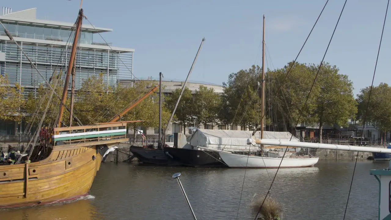 Wide Shot of Vintage Ship Sailing Through Bristol Marina In Bristol England