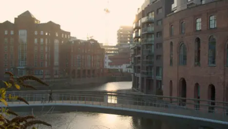 Tracking Shot of Woman and Child Walking Over Castle Bridge In Bristol 