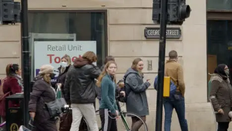 Long Shot of People On Corner of George Street In Oxford England