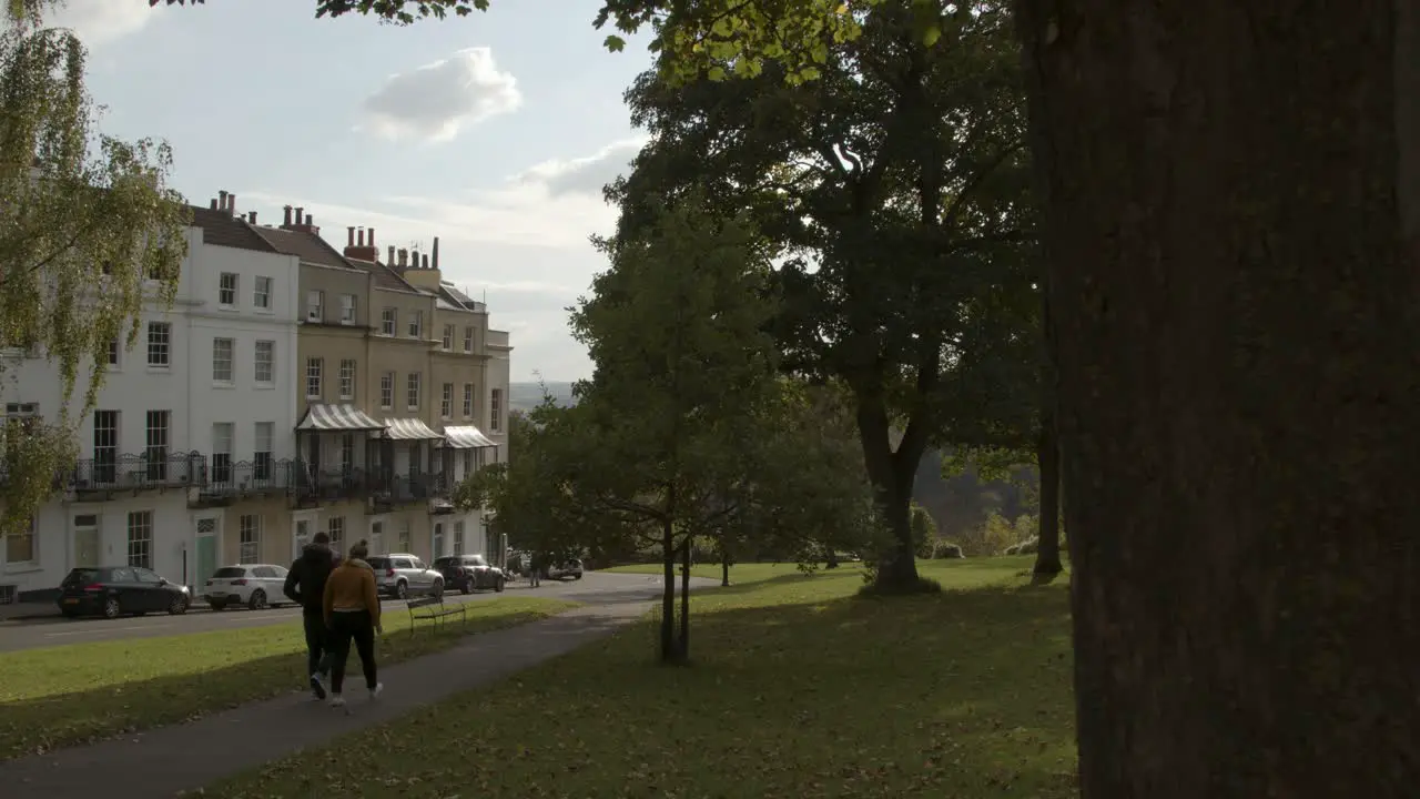 Tracking Shot Past Tree Following People On Sion Hill In Bristol 