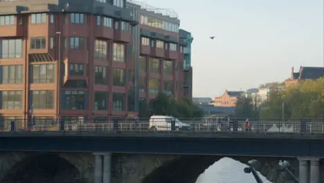 Wide Shot of Van and People Travelling Over Bristol Bridge In Bristol England