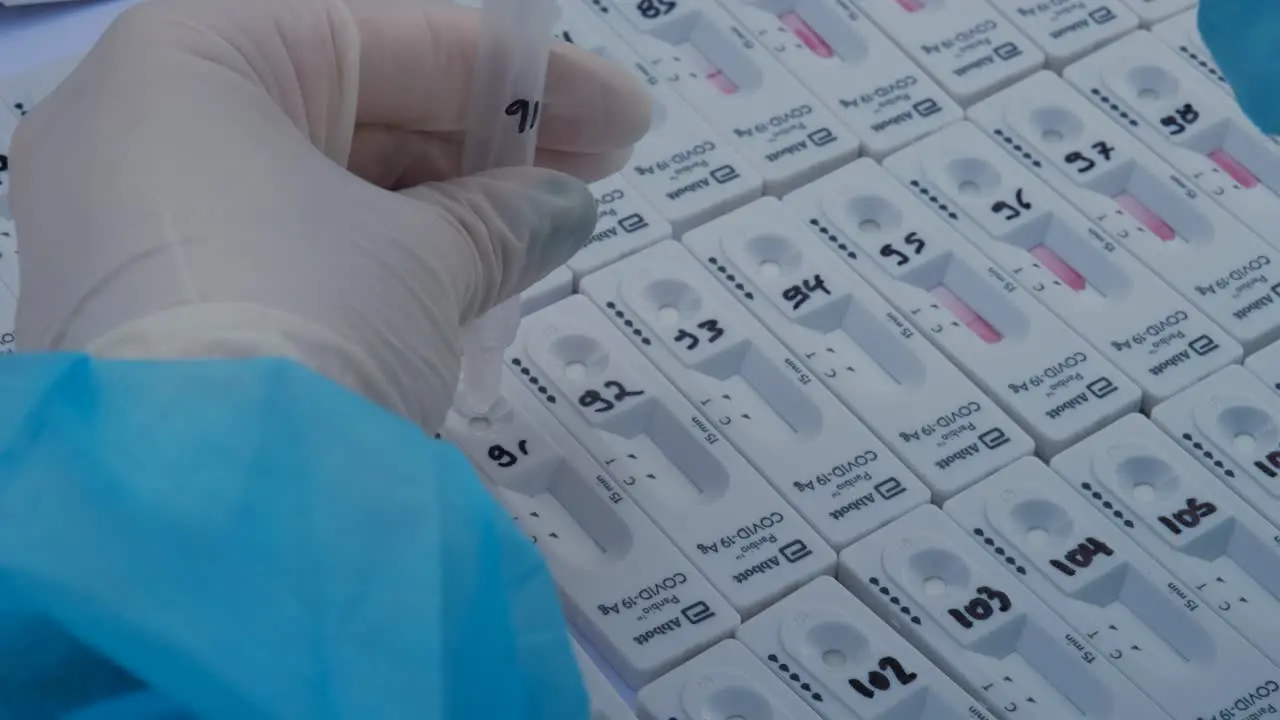 Close-up of a healthcare worker placing samples for the Abbott rapid COVID-19 test in Paphos Cyprus during the pandemic