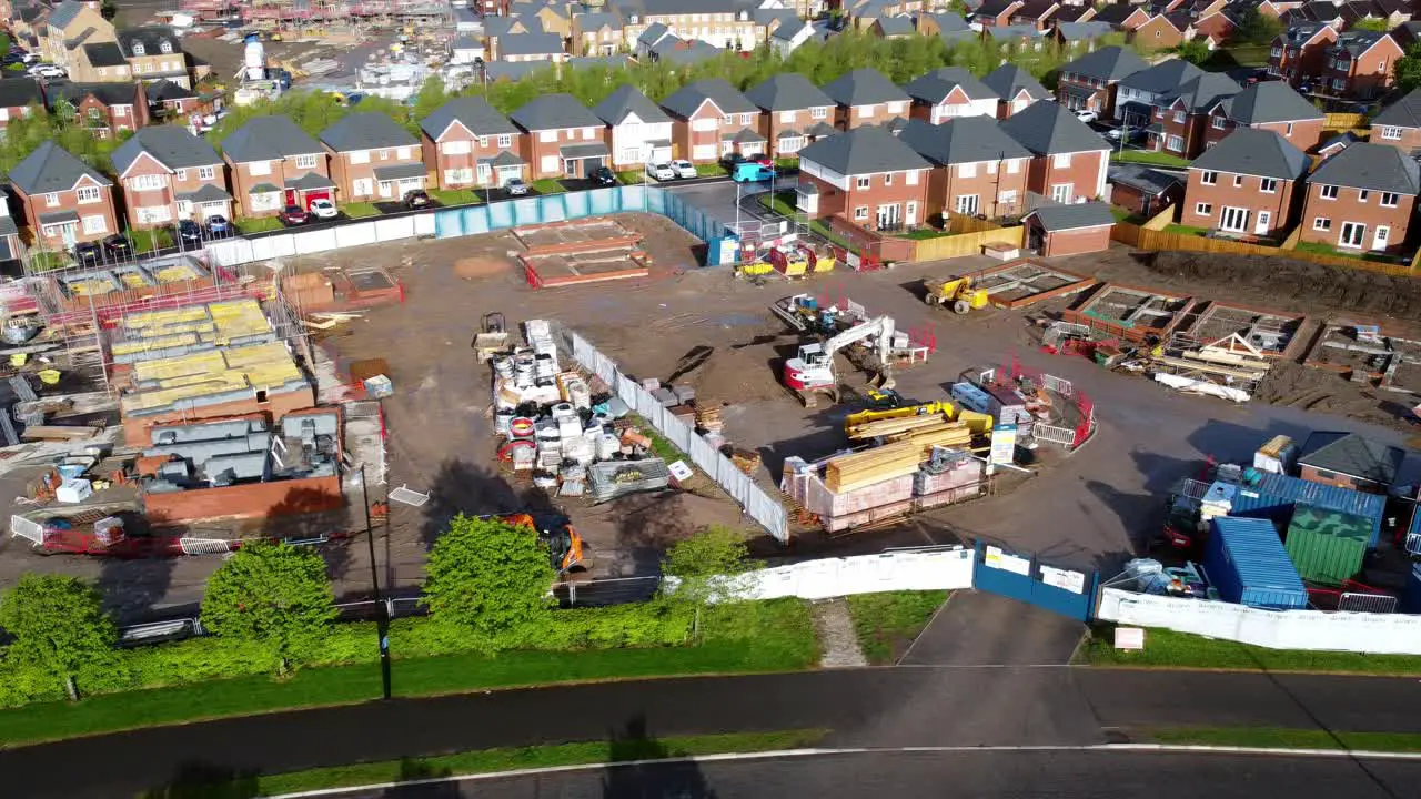 Construction site aerial view above new urban real estate housing development regeneration pan right