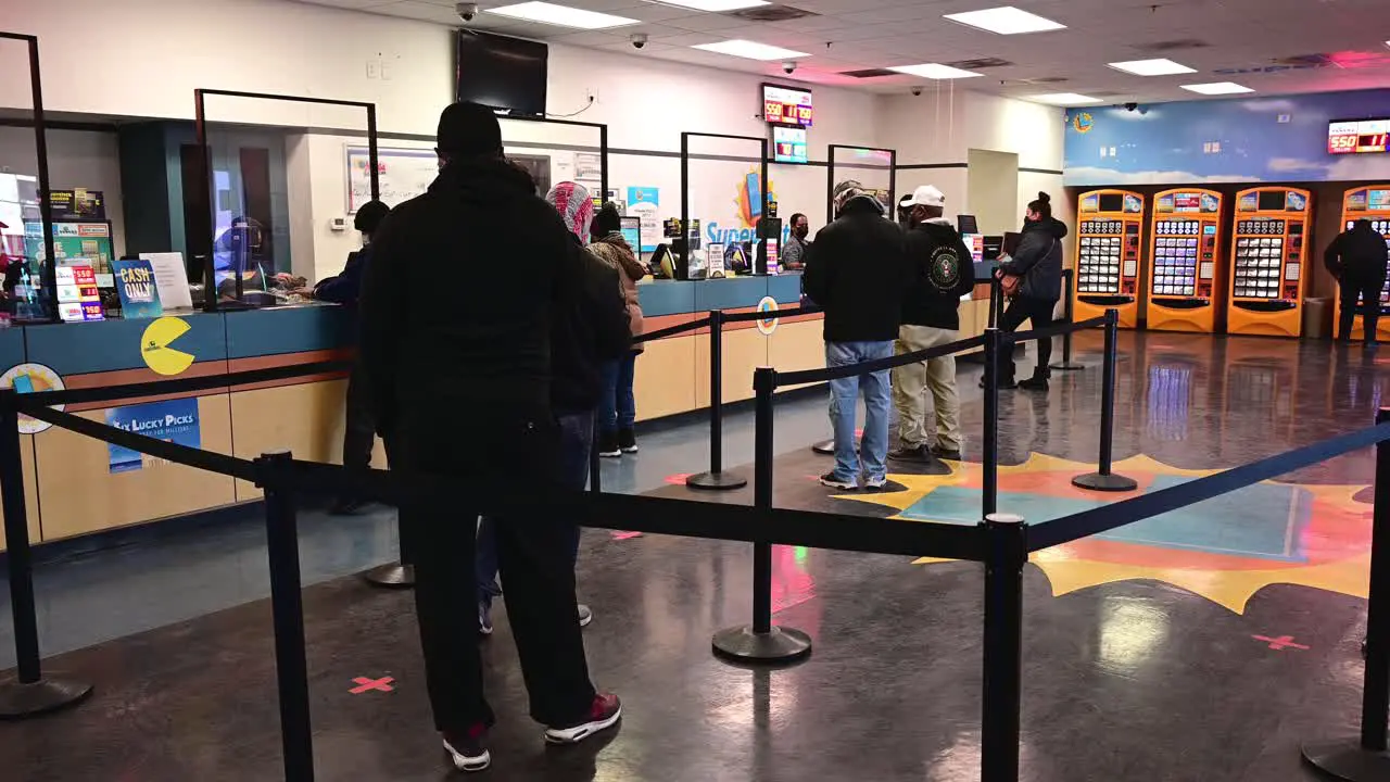 People waiting in line to buy lottery tickets