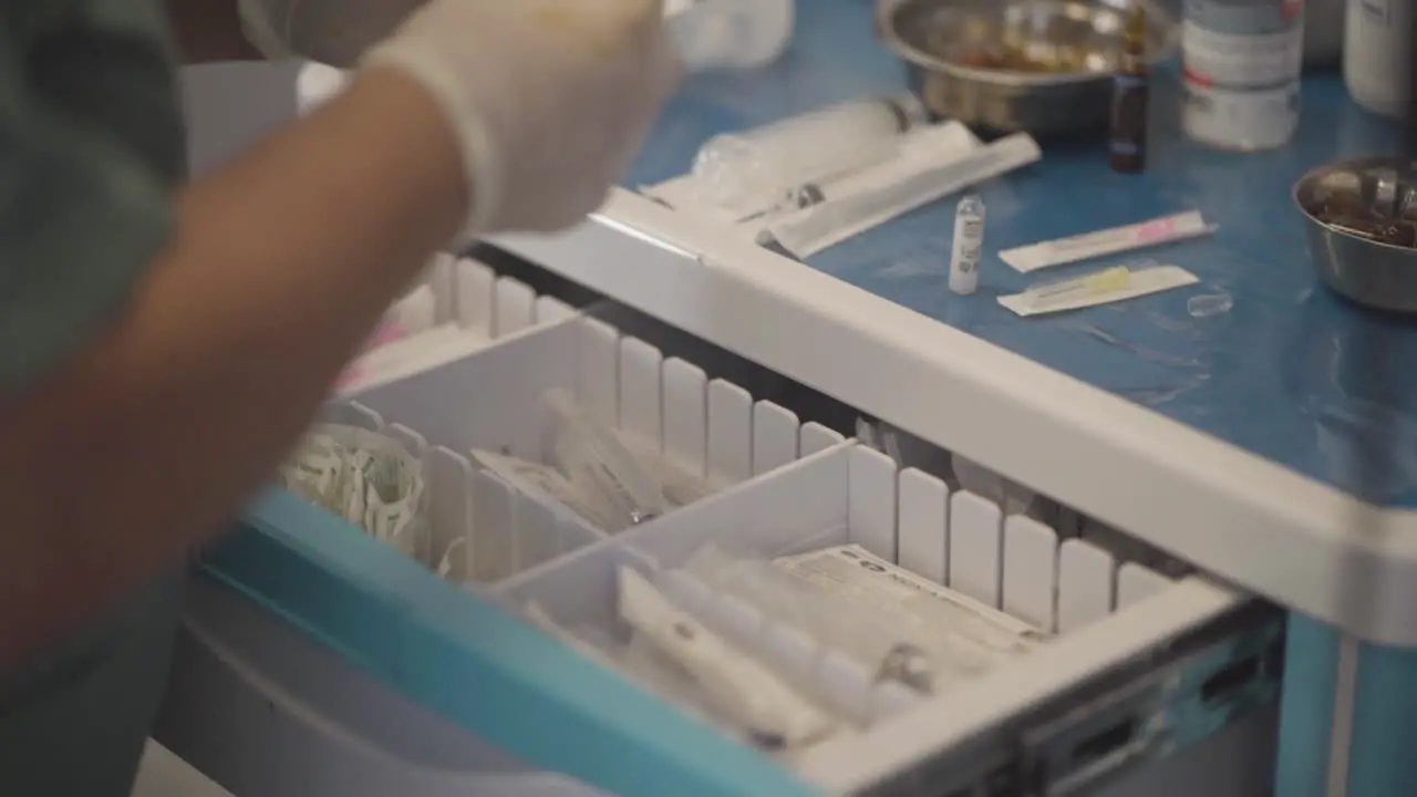 Nurse meticulously preparing medications for patient administration exemplifying compassionate care and precise medical attention