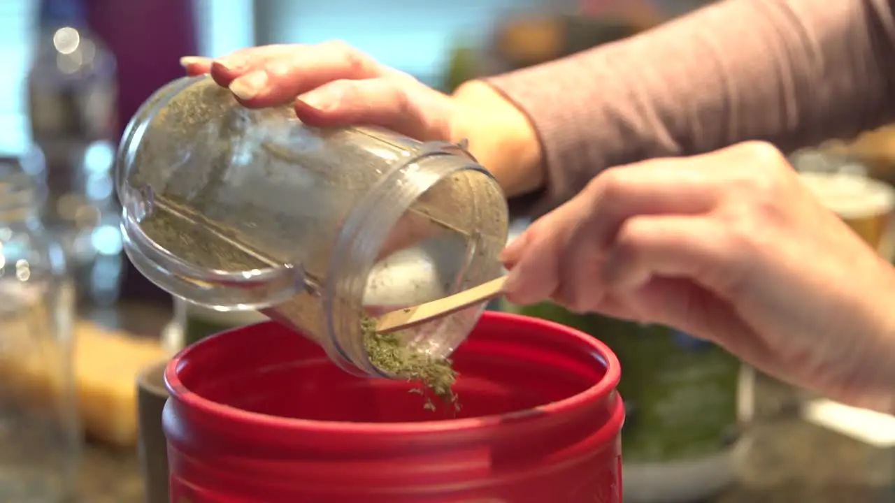 Processed Cannabis Mixed With Ingredients In A Container To Create Herbal Remedies close up shot