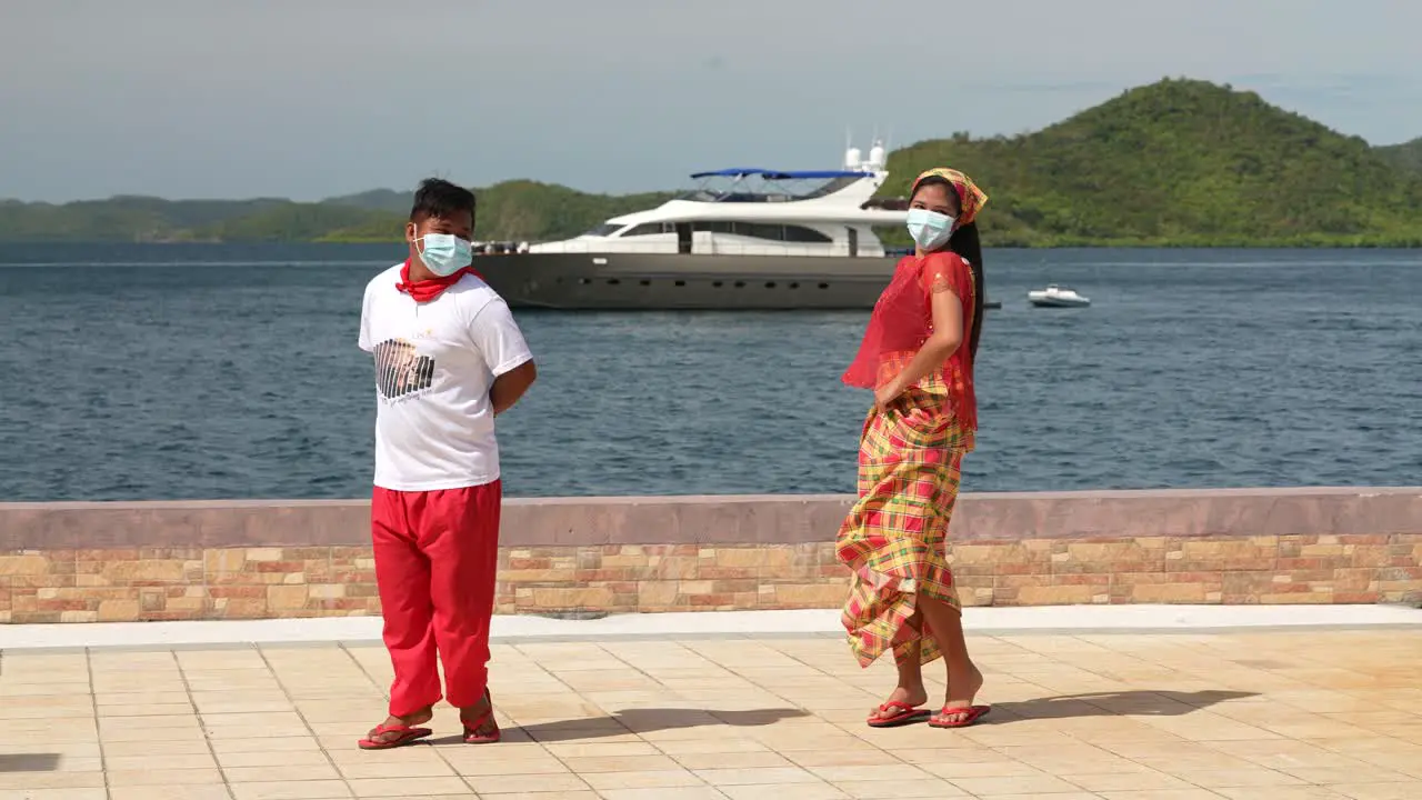 Indigenous Dancers Performing on a Dock Slow-Mo 4k