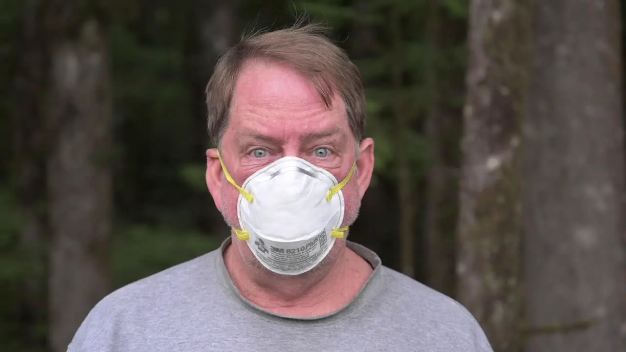 An Adult Man Wearing N95 Face Mask To Protect Himself While In The Forest In Bandon Oregon Zoom-in Shot