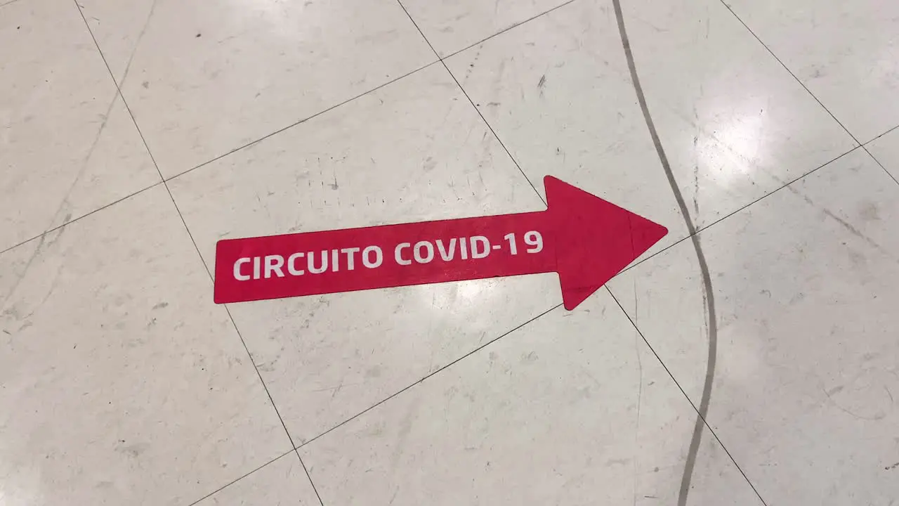 COVID Circuit red arrow floor sticker in Clinic Hospital