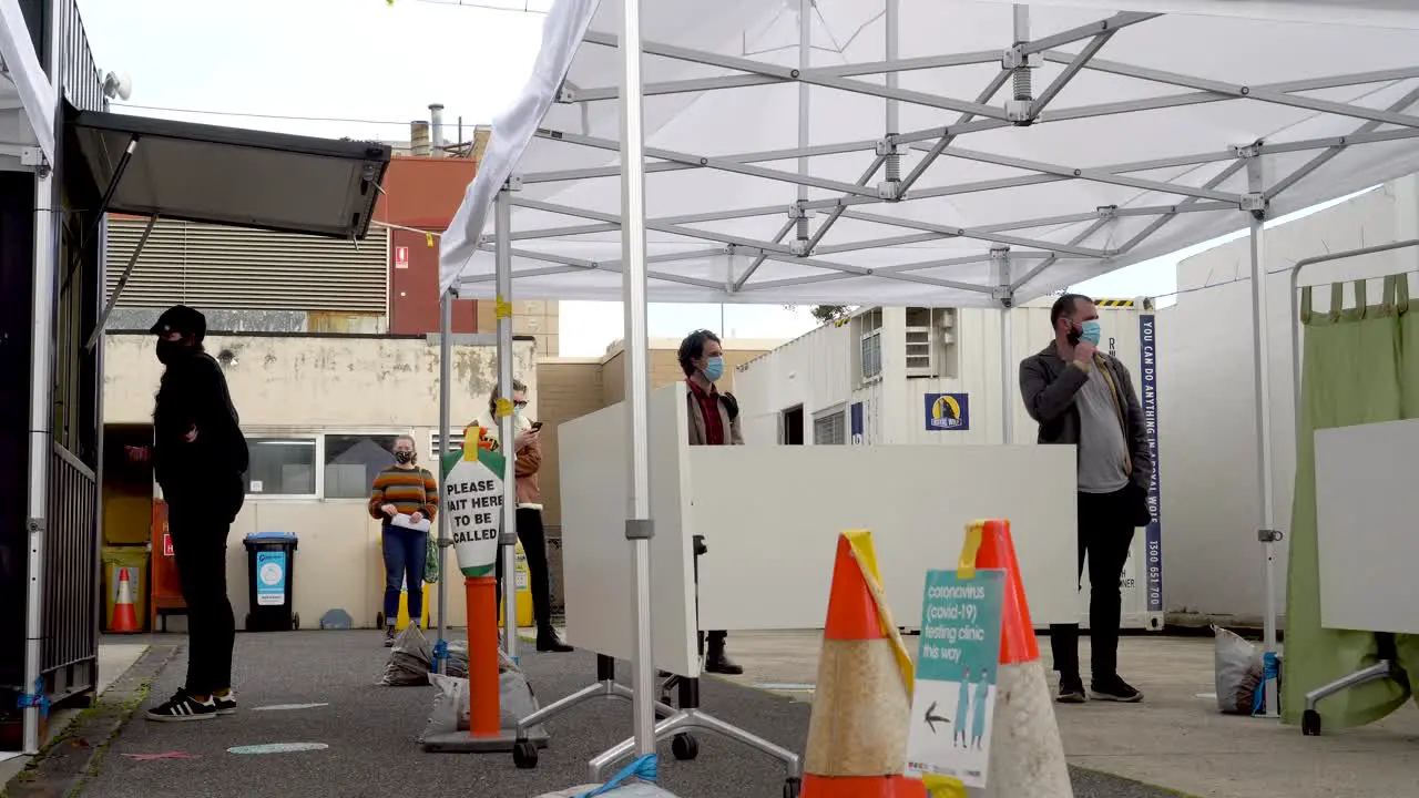 People wait at a coronavirus testing clinic in Australia at the height of the COVID-19 outbreak