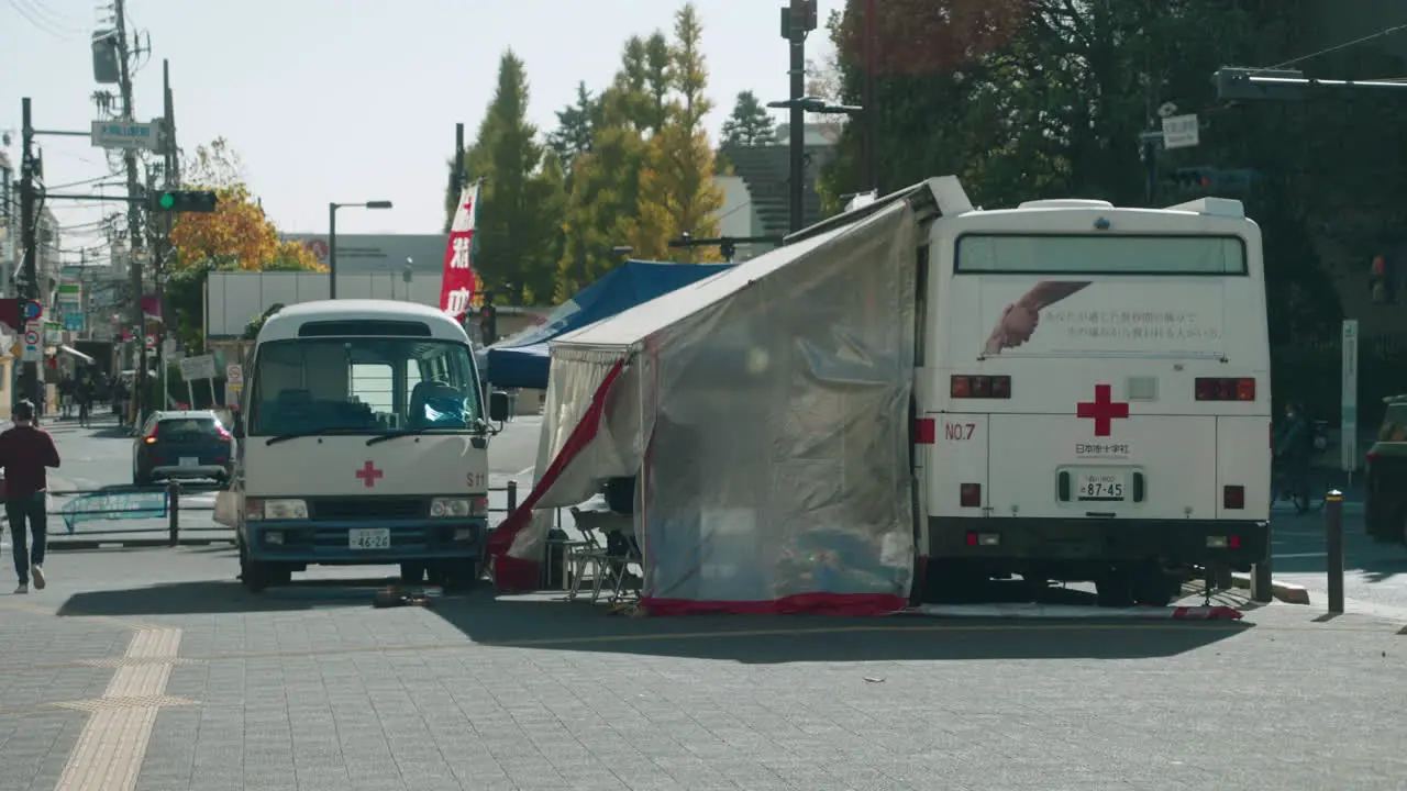 Red Cross Bloodmobile On The Street Of Tokyo During Pandemic Blood Donation Drive In Japan full shot slow motion