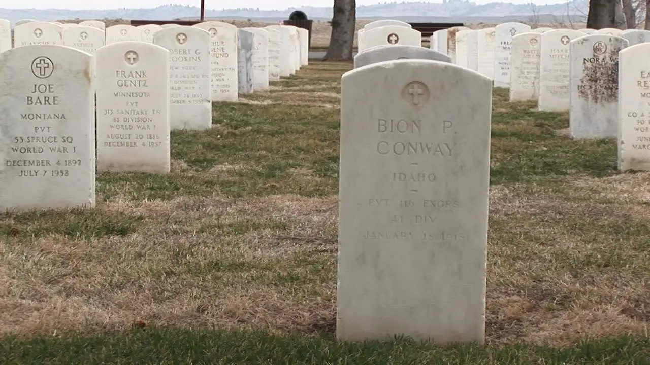 The Camera Pans Left Across Rows Of White Marble Headstones In Arlington National Cemetery