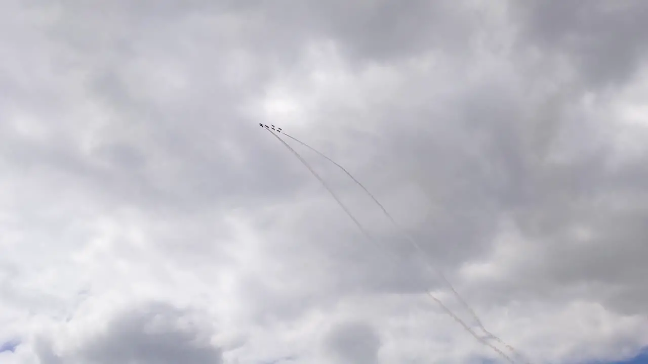 Multiple Red Arrows Planes Ascending High into Clouds During Air Show in Swansea Bay