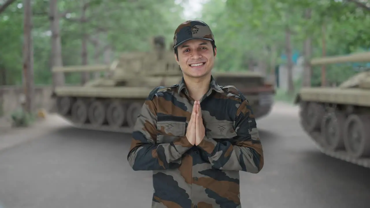 Happy Indian army man doing Namaste