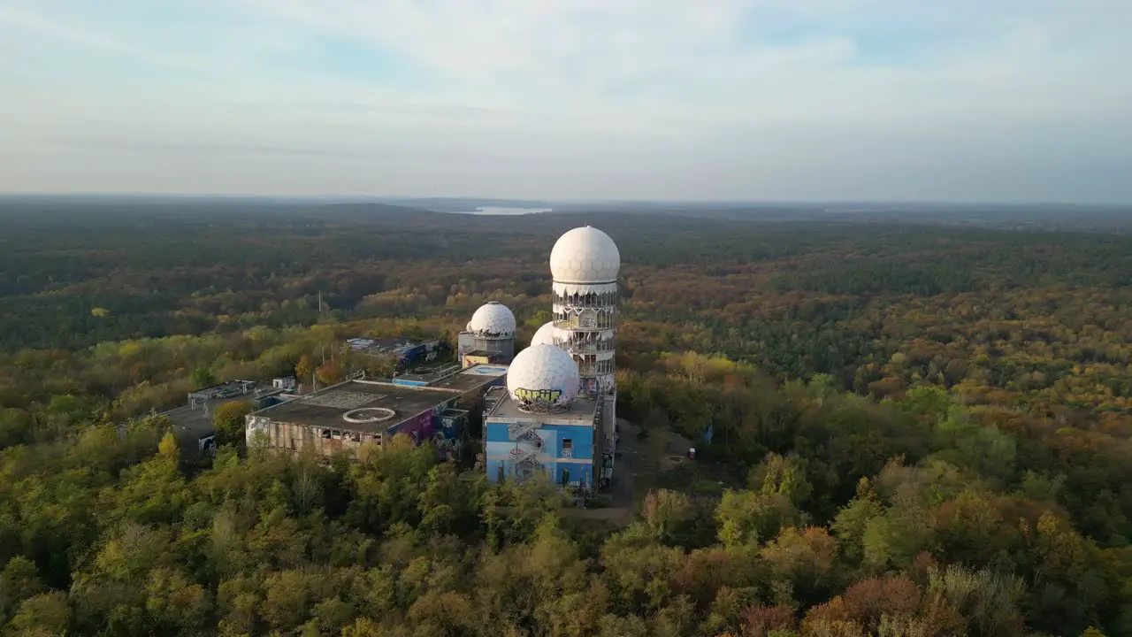 Amazing aerial view flight pull in drone of Radom in
autumn forest at morning sunrise devil's mountain in woods berlin October 2022