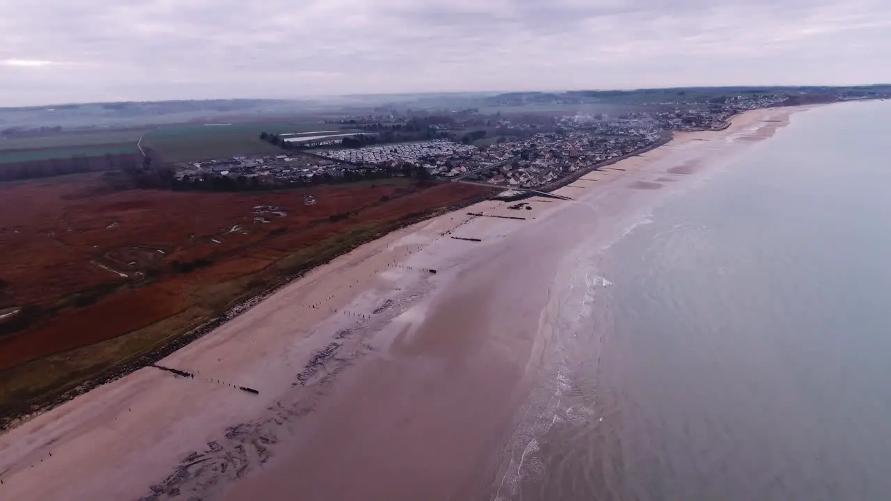 Aerial view of Asnelles city in Normandy oyster aquaculturist town cloudy day