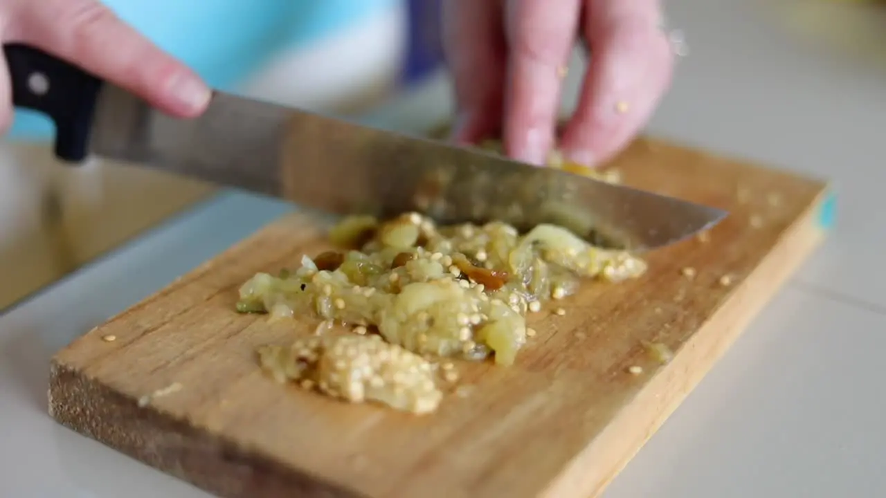 Chopping up Fried Eggplant Close Up