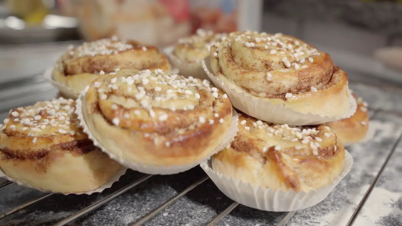 Static handheld footage of a pile of cinnamon buns