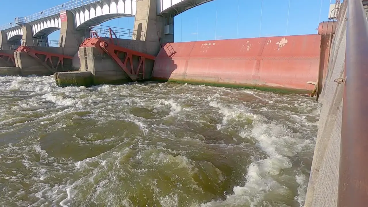 Dam 14 and turbulent downstream water of the Mississippi River Hampton Illinois