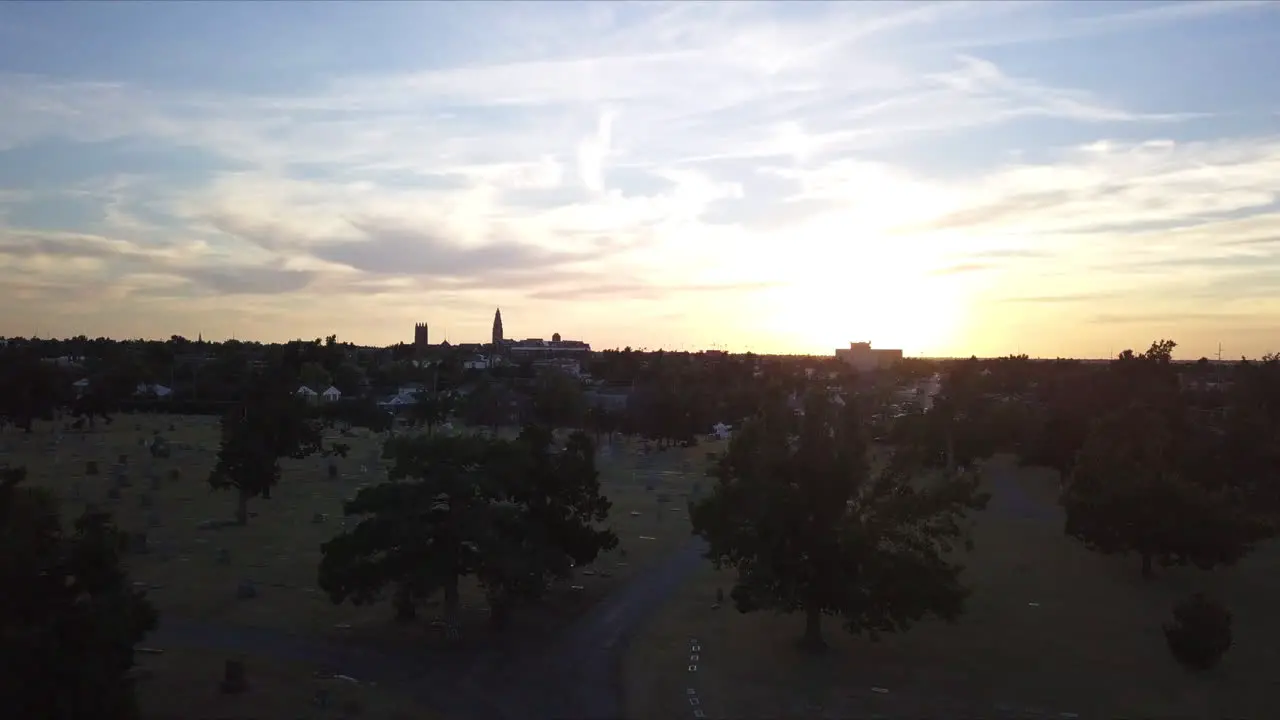 Slow flight over a graveyard during sunset in Georgia