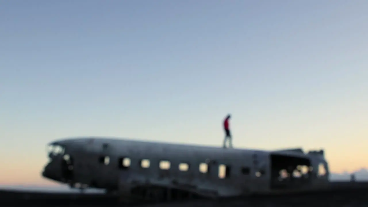 Crashed plane in southern Iceland outside Vik at a black sand beach during sunset