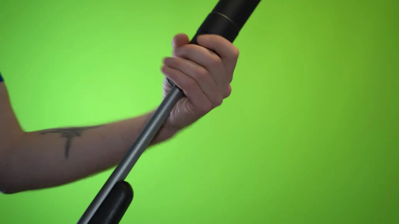 Mounting a silencer on a single barrel shotgun weapon on green screen