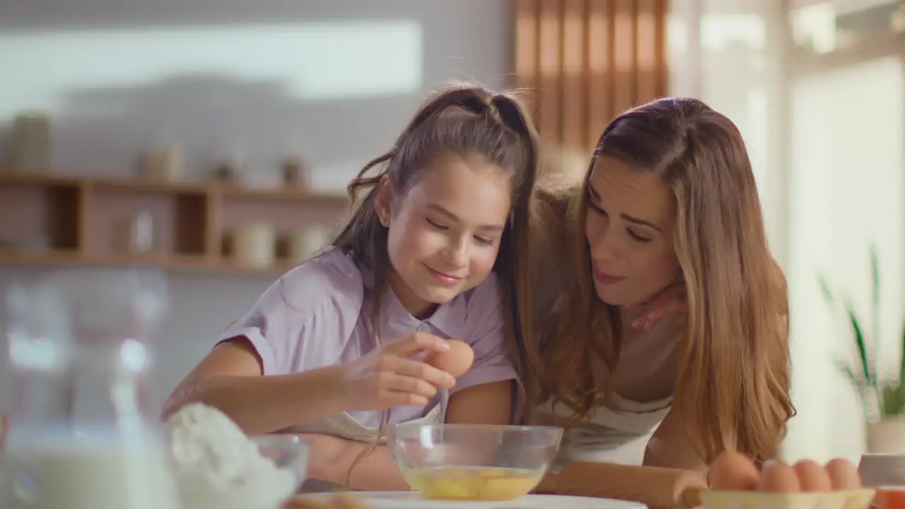 Mother and daughter baking together