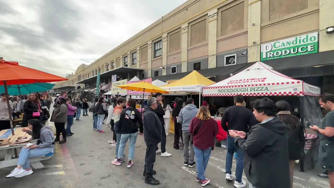 Walking along the open air food vendors at Smorgasburg in Los Angeles California