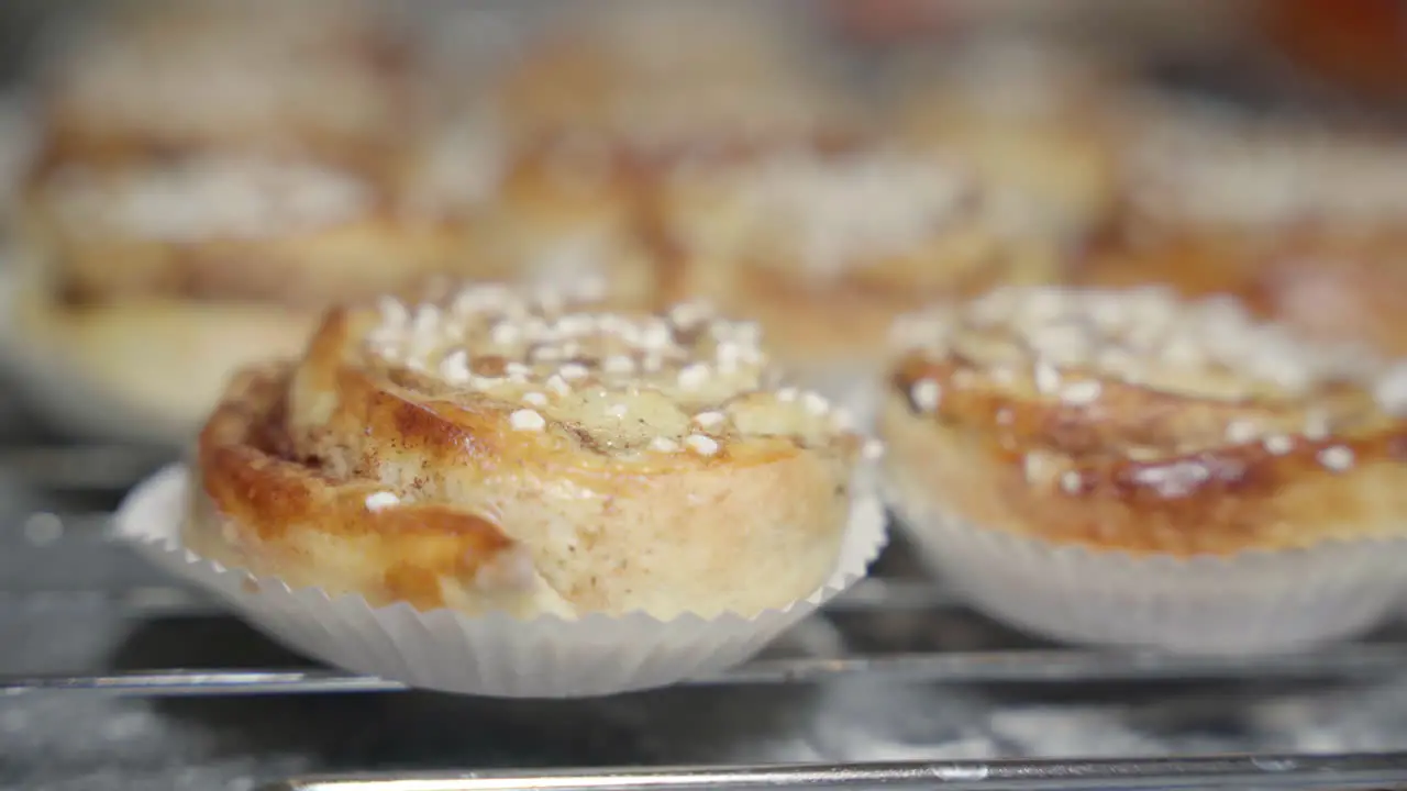 Sliding shot over a pile of cinnamon buns