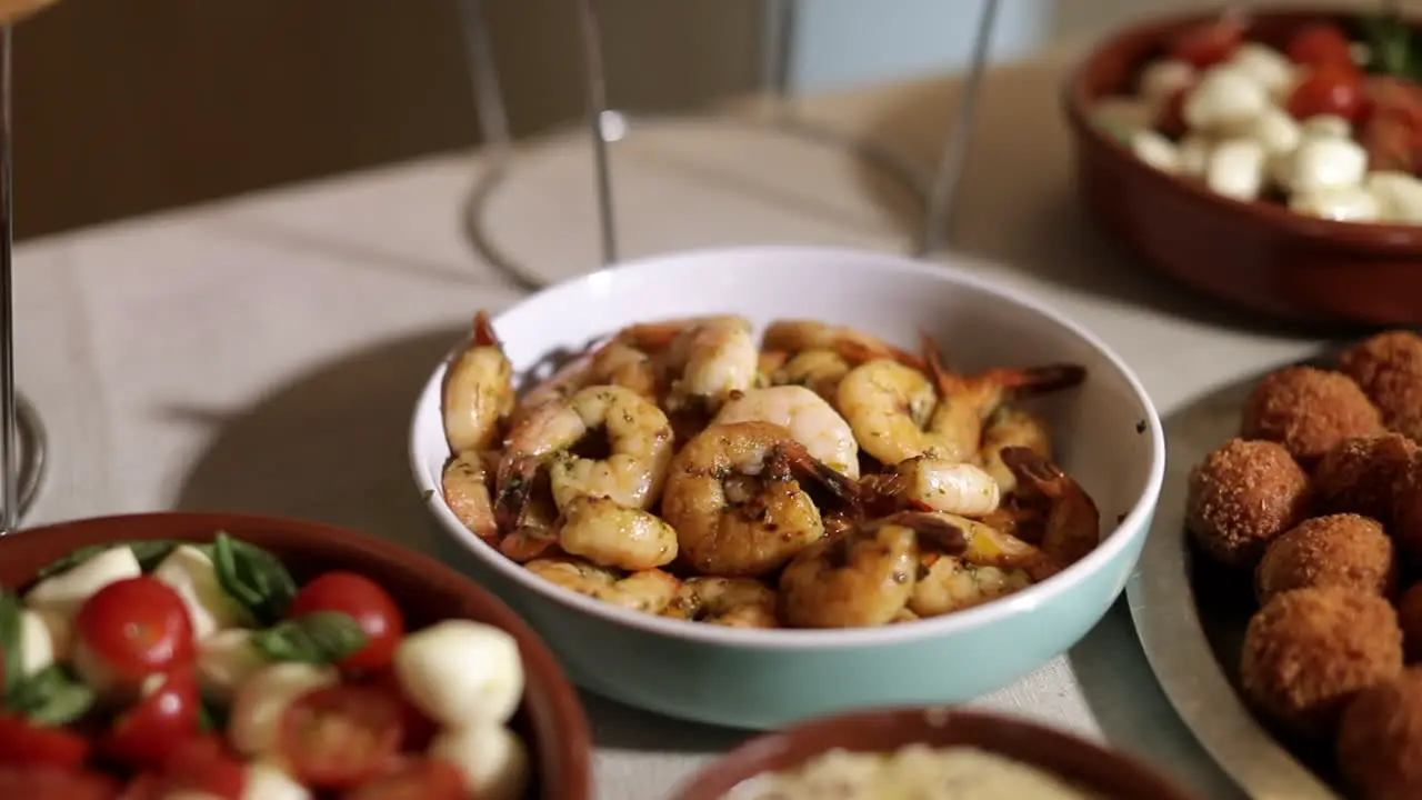 Close up of freshly cooked shrimps tomato salad at a serving table