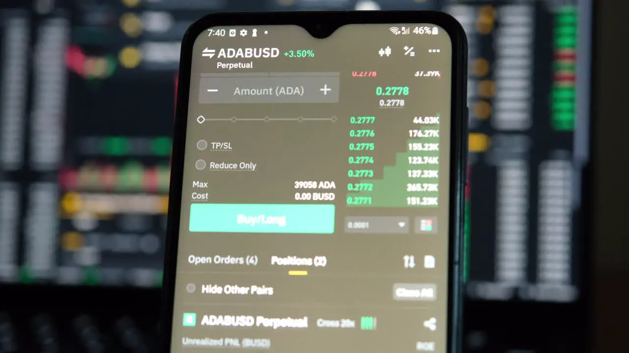 Trading cryptocurrency on the phone with a candle stick charts in the background