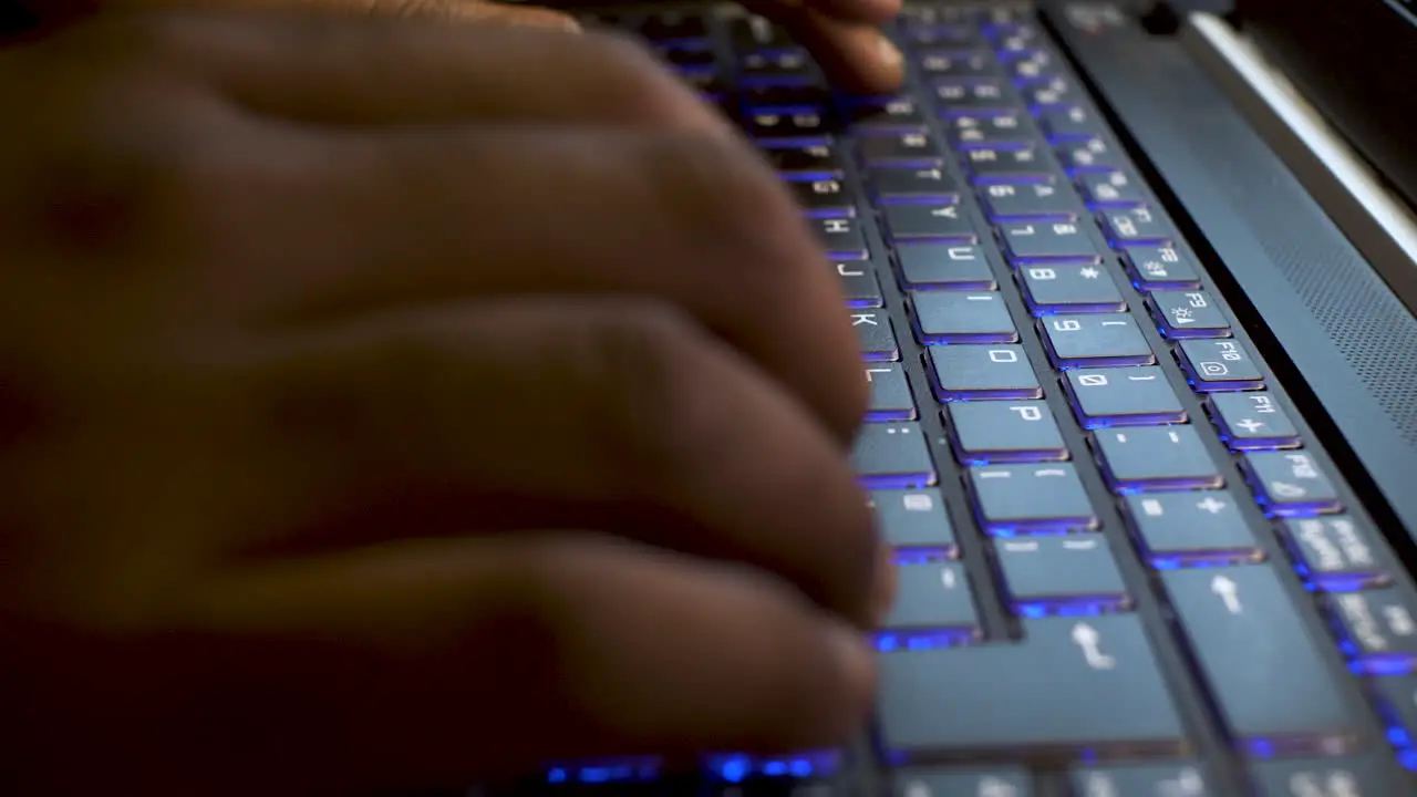 Hacker Typing on Laptop Keyboard Close up View on Hands