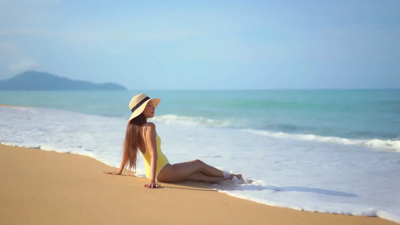 Beautiful Woman Sitting on Secluded Tropical Beach Paradise Sea Scene