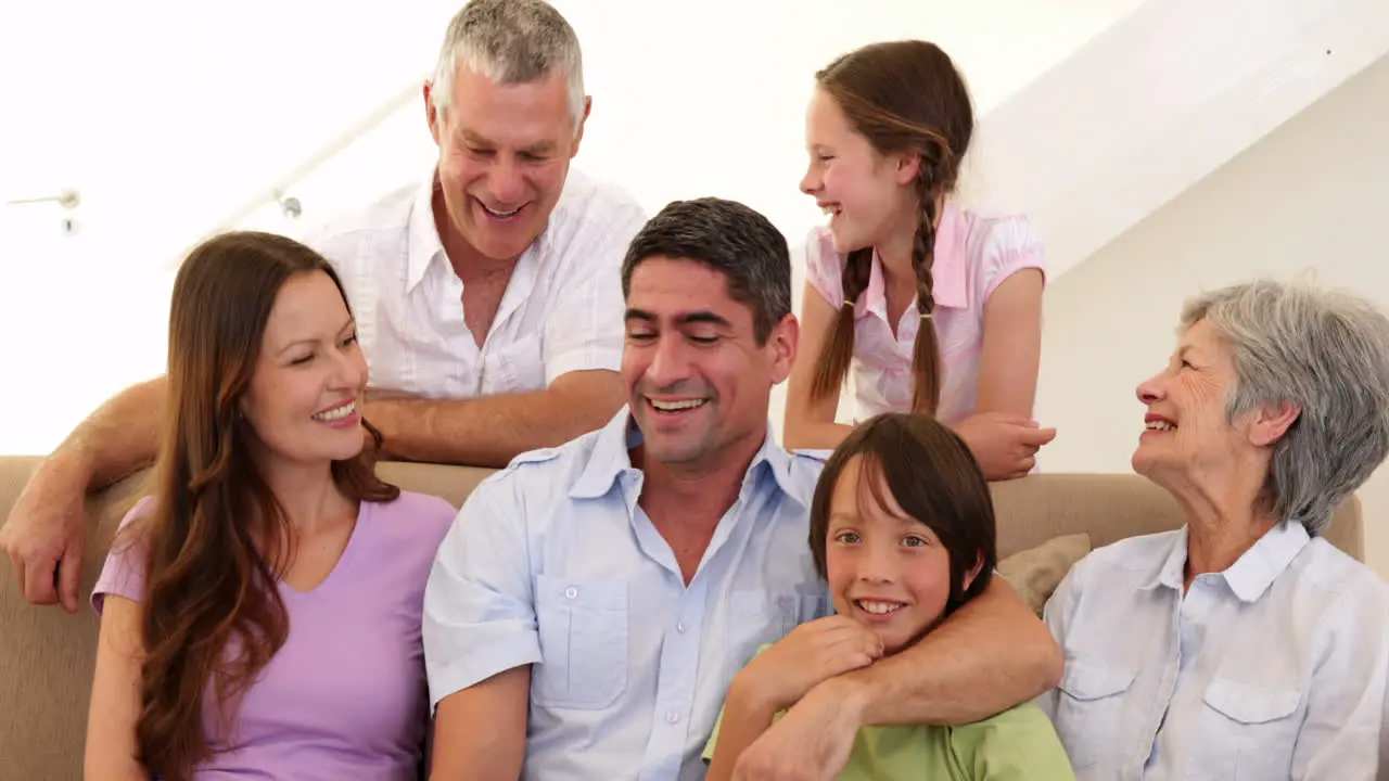 Extended family posing for photo on the couch