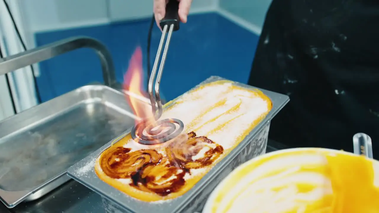 Designing and decorating ice cream using flames and fire