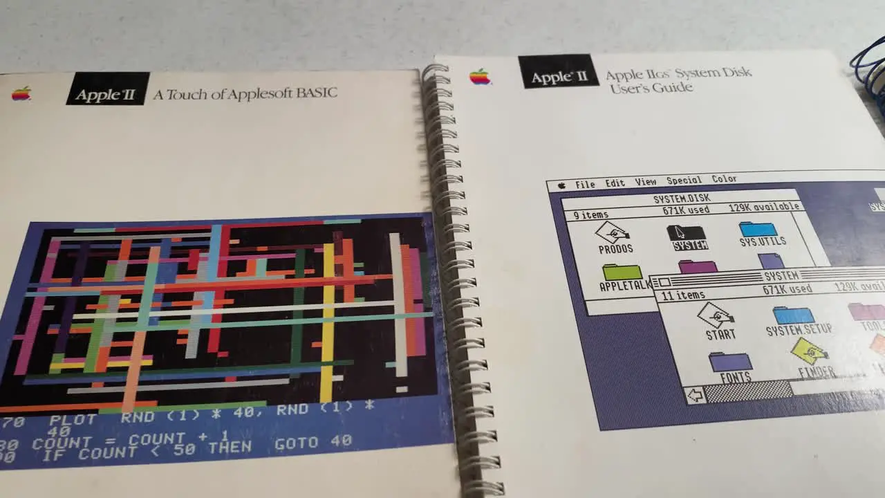 Close-up shot of Apple IIGS System Disk User's Guide vintage Apple IIGS reference books from home computer computing era