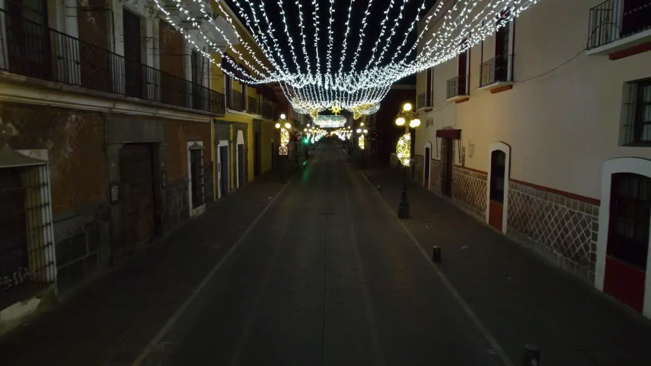 Drone footage of the Christmas decorations of lights in the colorful streets