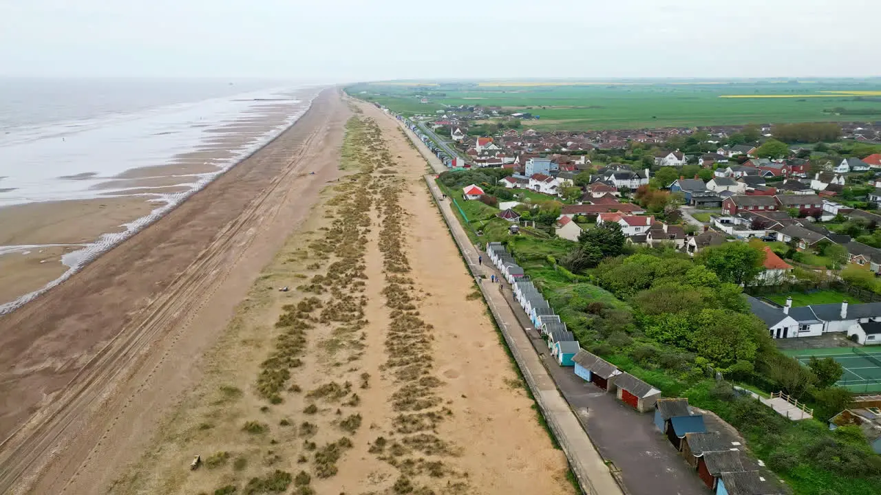 Aerial footage brings Mablethorpe to life highlighting beach huts sandy beaches amusement parks rides and the joyful tourist atmosphere