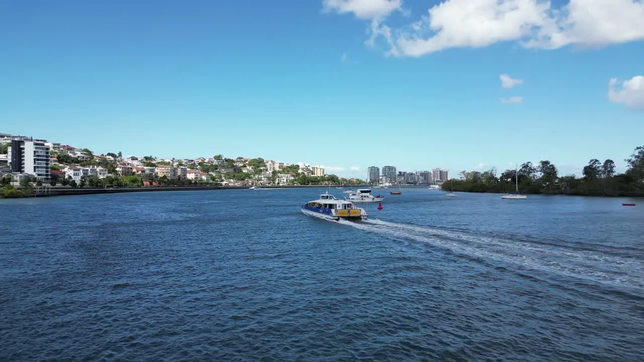 Following a CityCat ferry at Newstead on the Brisbane River in summer