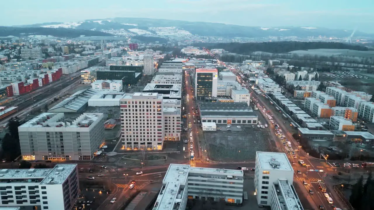 backward flight over an busy urban area with allot of traffic and bright street lights