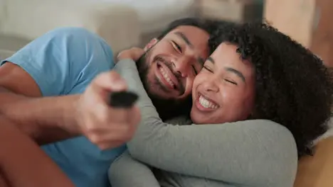 Happy couple watching tv relax