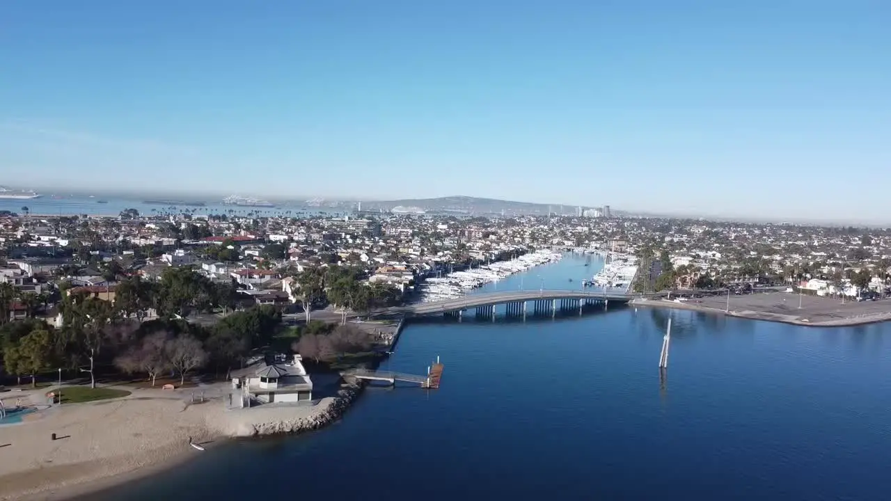 Drone flies over bridge on water channel