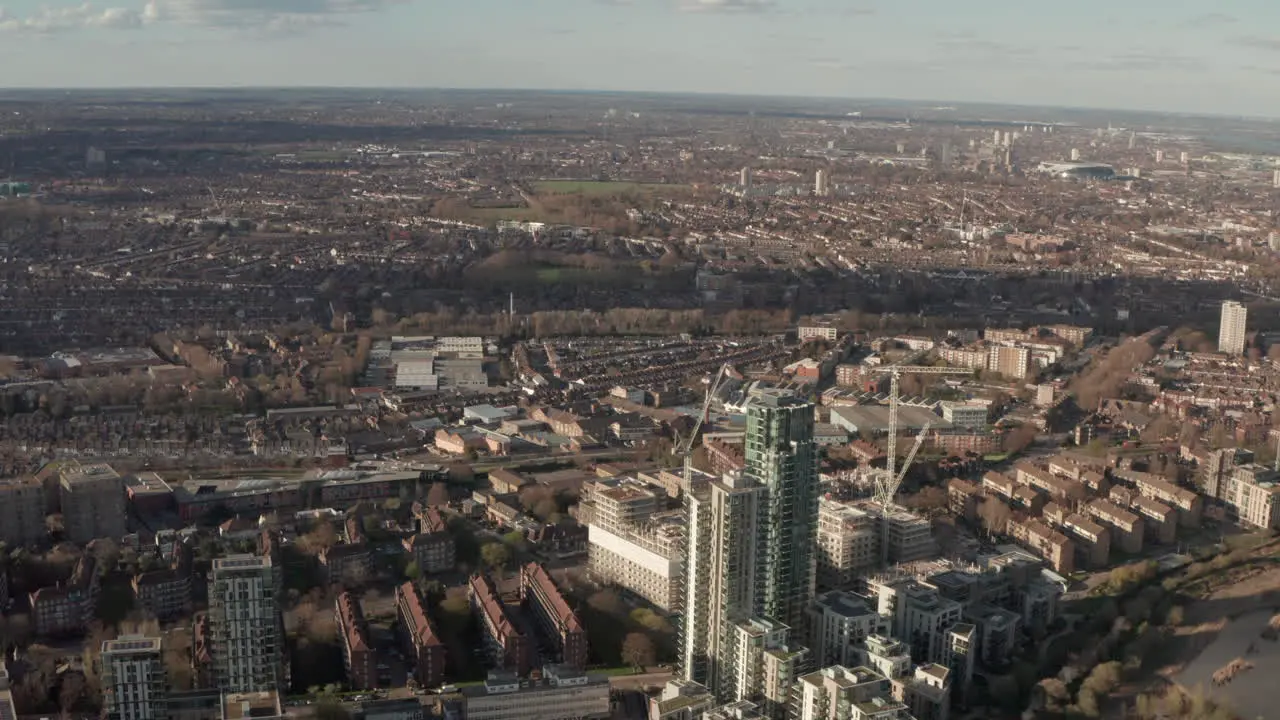 Circling reveal aerial shot of Haringey warehouse district North London