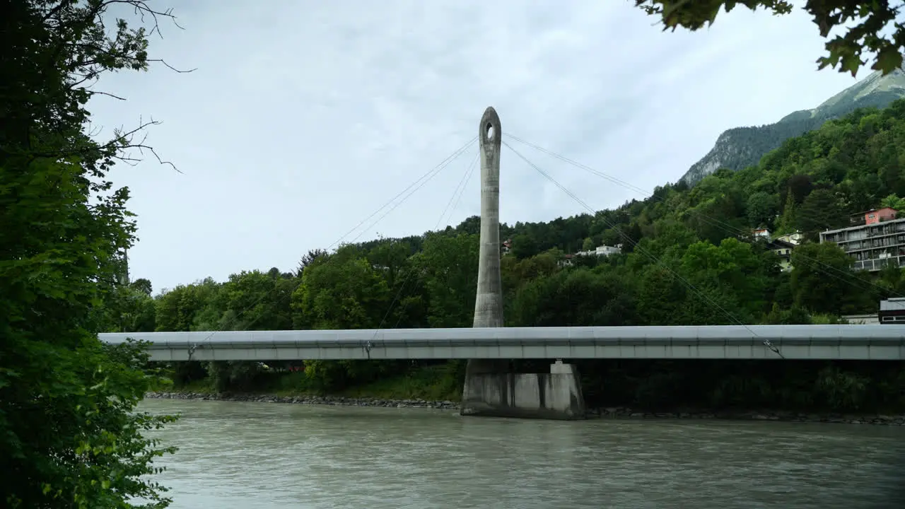 Handheld Shot of the River the Inn Flowing Under the Neue Hungerburgbahn Bridge in Innsbruck Austria