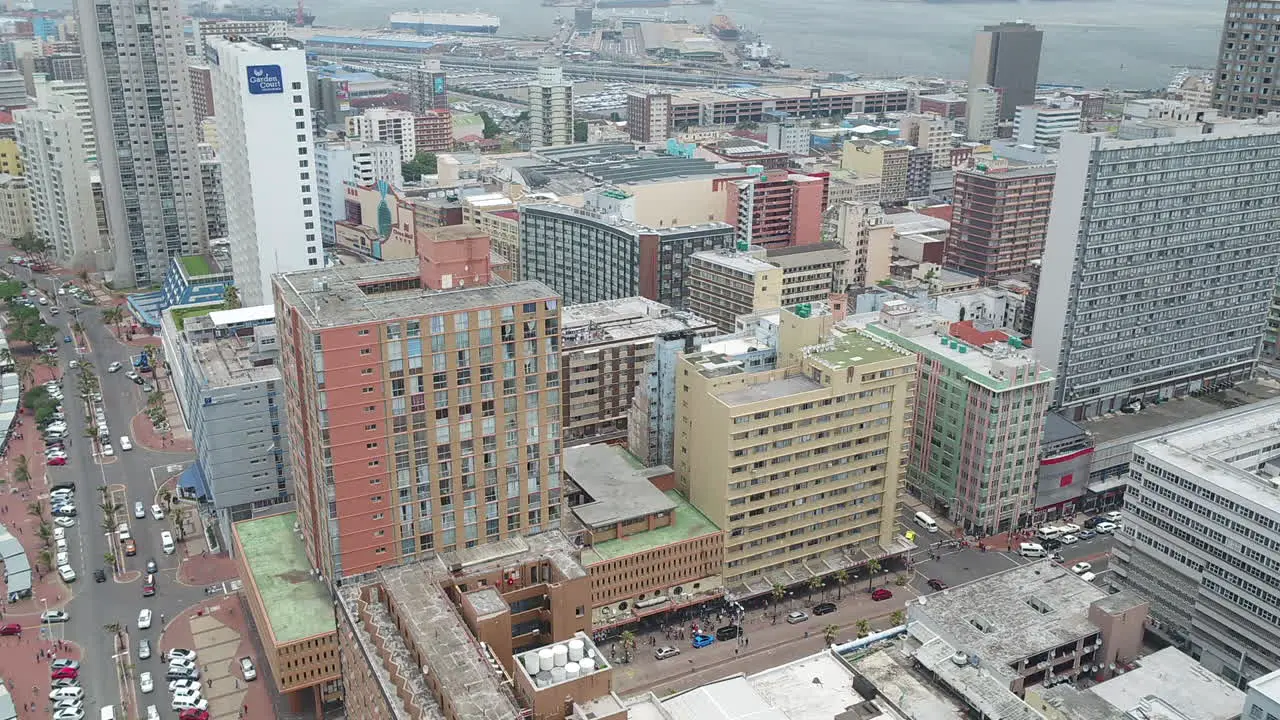 Drone pan onto Durban South Africa city centre buildings and offices HD