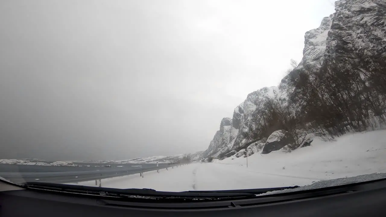 Road covered in snow in Norway view from the car