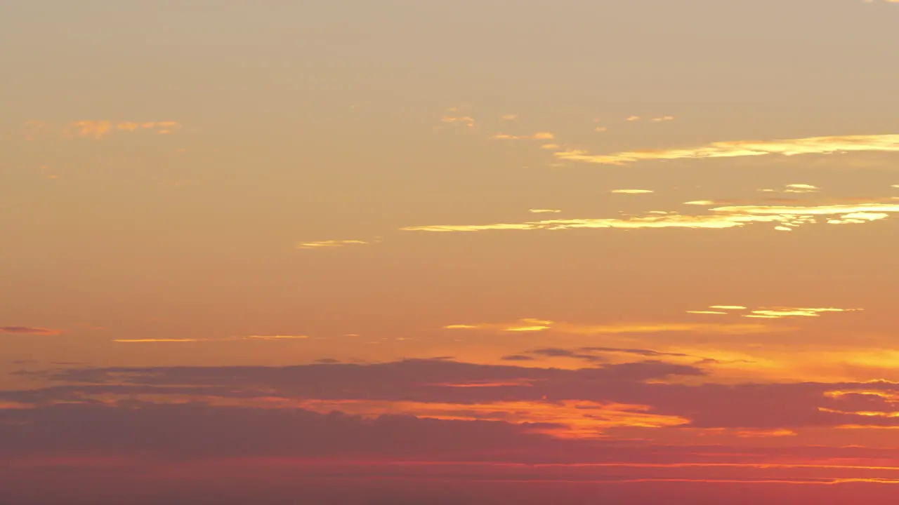 Flying airplane in the evening sky