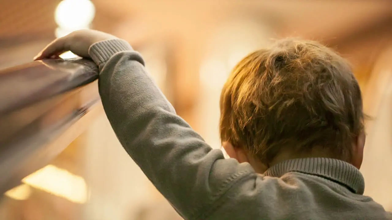 Boy on the airport escalator