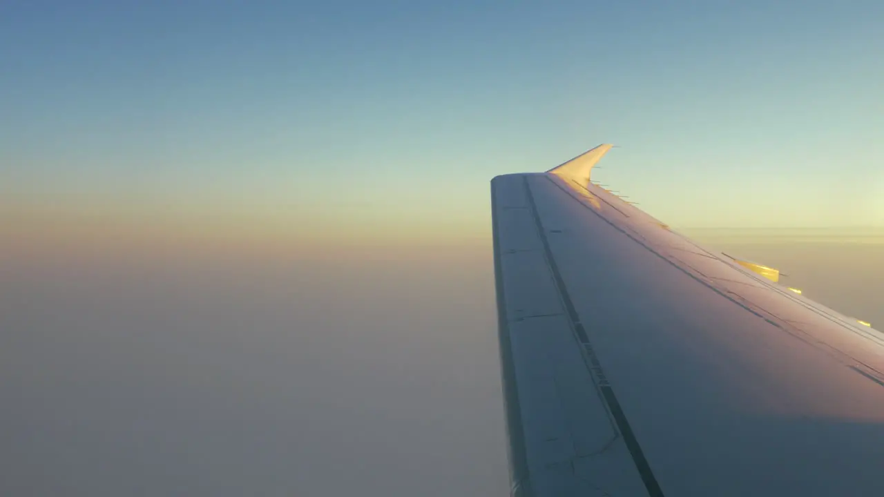 Illuminator view with morning sky and plane wing