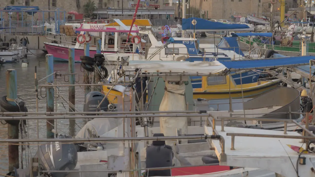 Tied up boats in the port of old Acre city Israel